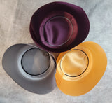 Hat liner with Piping group shot showing examples of Burgundy w/ Silver Pipe, Gold w/ Black Pipe, Silver w/ Black Pipe